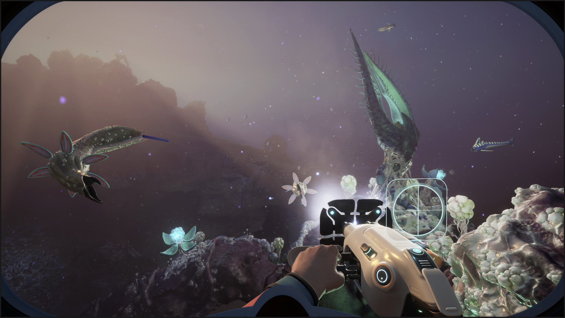 Official Subnautica 2 promotional screenshot showing underwater wildlife and a handheld tool view